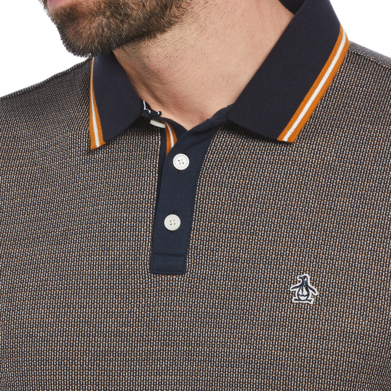 Polo jacquard marrón con ribete naranja