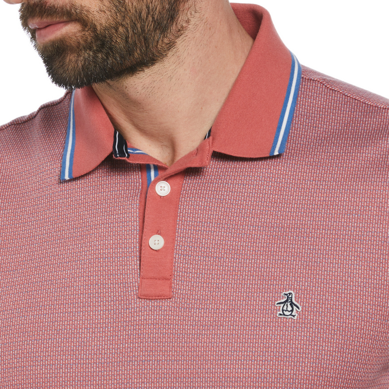 Polo jacquard rojo con ribete azul