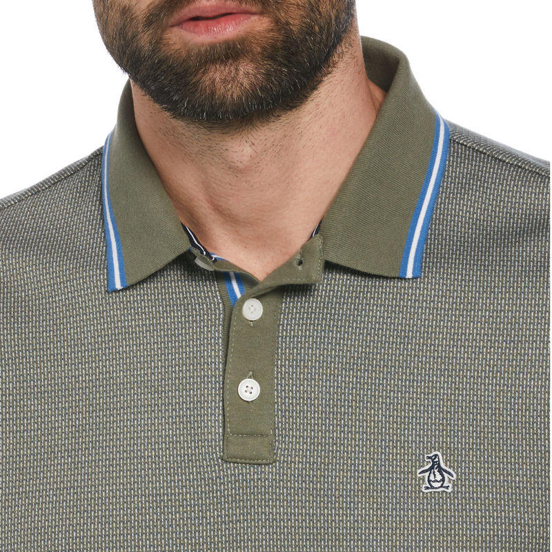 Polo jacquard verde con ribete azul